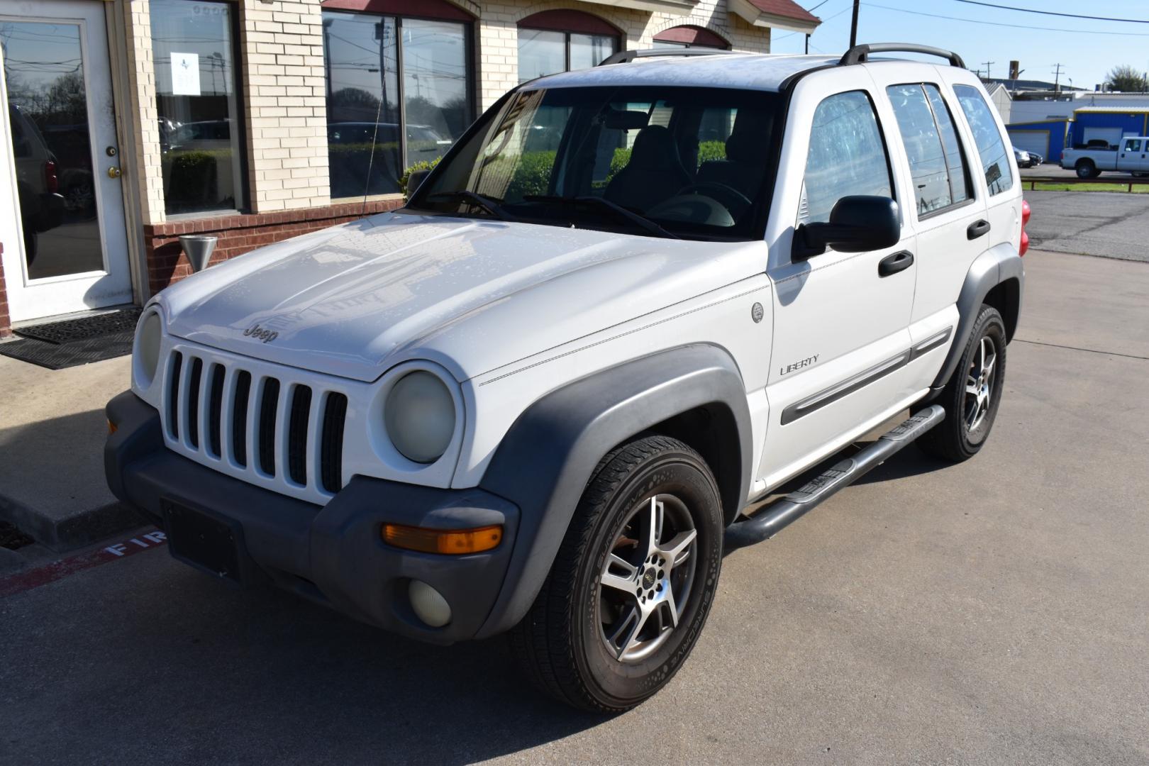2004 White /Tan Jeep Liberty (1J4GL48K34W) , located at 5925 E. BELKNAP ST., HALTOM CITY, TX, 76117, (817) 834-4222, 32.803799, -97.259003 - Buying a 2004 Jeep Liberty can offer several benefits, depending on your needs and preferences: Off-road Capability: The Jeep Liberty is known for its off-road prowess, with features such as available four-wheel drive and a rugged design that can handle various terrains. If you enjoy outdoor activi - Photo#1